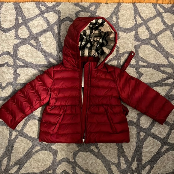 Burberry children’s winter jacket. Maroon outside, plaid inside.